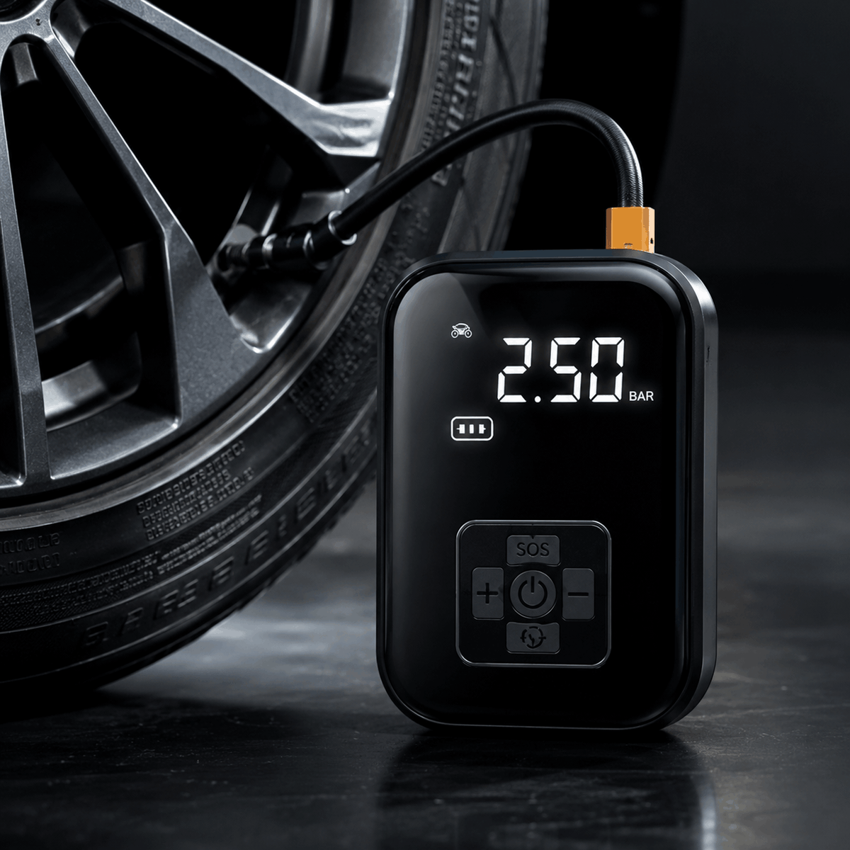 Digital tire inflator with a car tire in the background